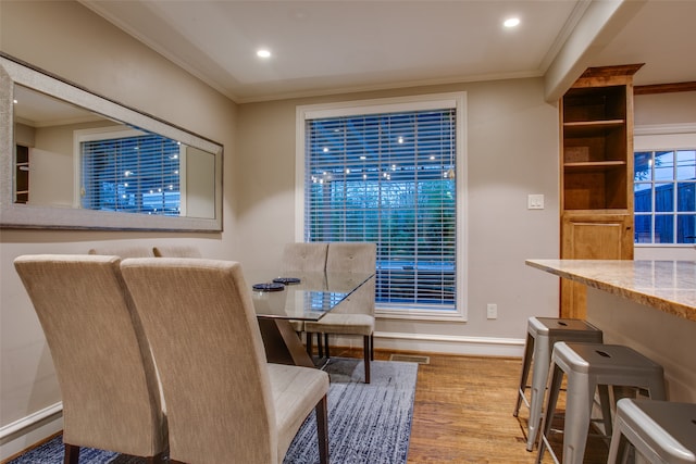 interior space featuring crown molding and wood-type flooring