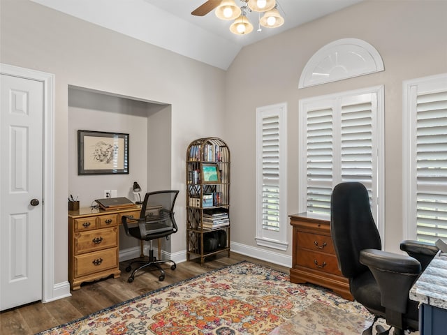 office space featuring dark wood-type flooring, vaulted ceiling, and ceiling fan