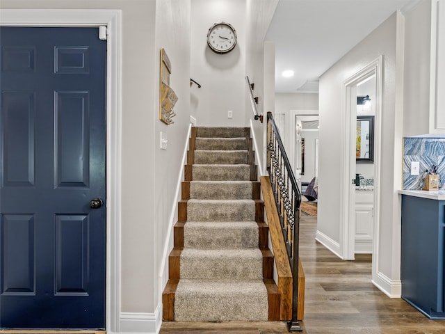 stairway with wood-type flooring