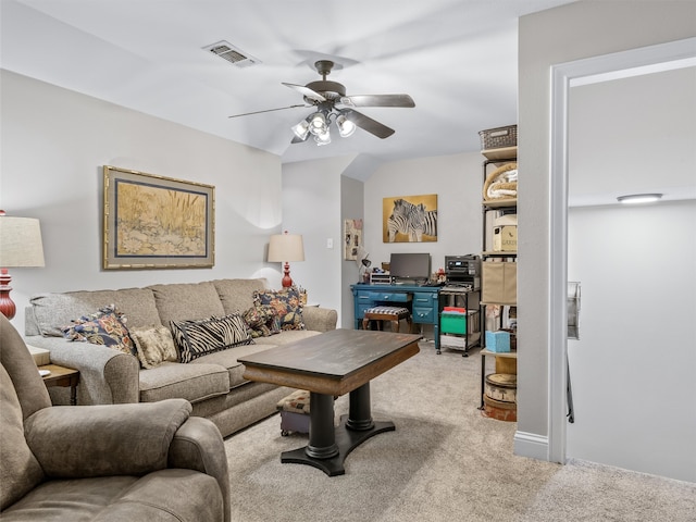 carpeted living room featuring ceiling fan