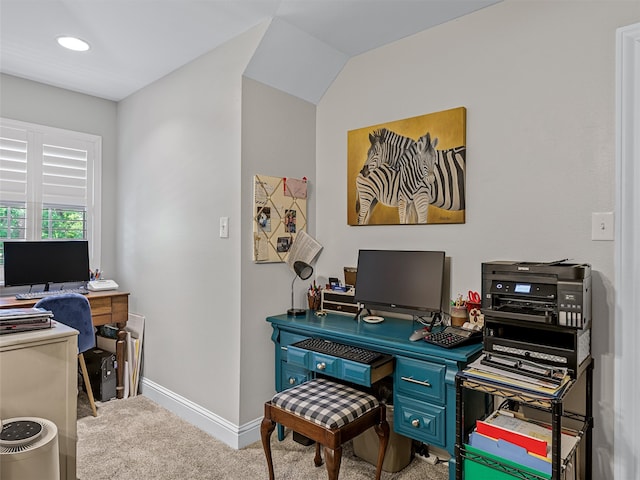 office featuring light carpet and vaulted ceiling