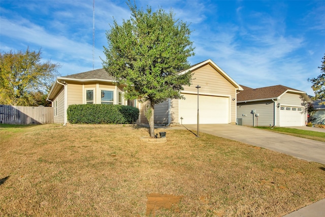 view of front of home with a garage and a front lawn