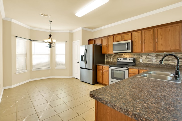 kitchen with appliances with stainless steel finishes, sink, ornamental molding, hanging light fixtures, and decorative backsplash