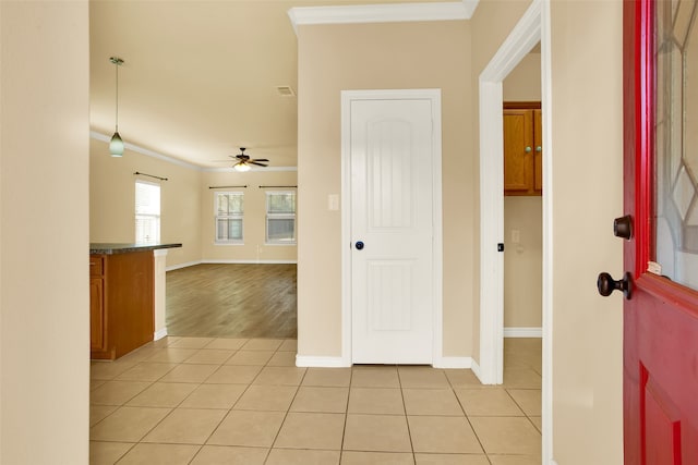 hall featuring ornamental molding and light wood-type flooring