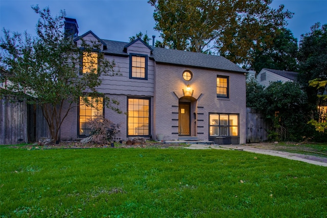 view of front of house with a yard