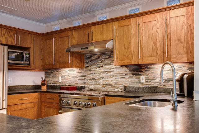 kitchen with crown molding, stainless steel appliances, decorative backsplash, and sink