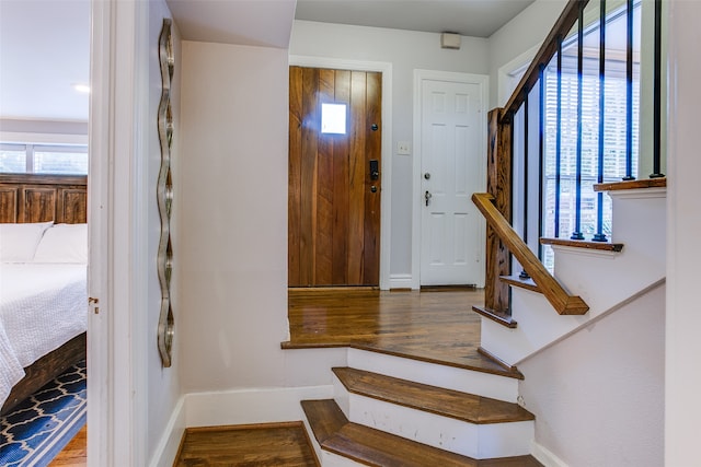 foyer with wood-type flooring