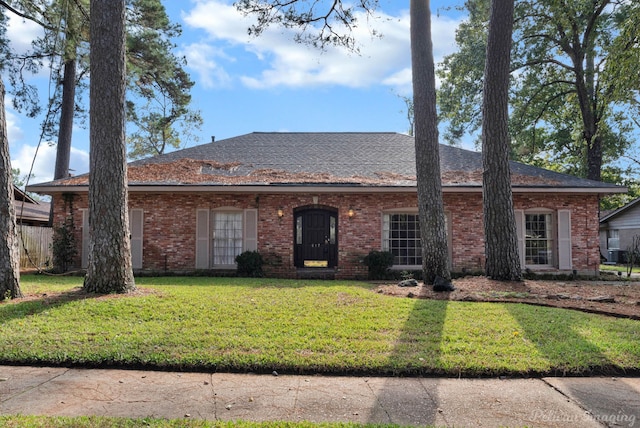 ranch-style house with a front lawn