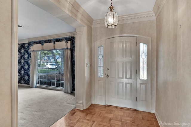 foyer entrance featuring crown molding and light parquet flooring