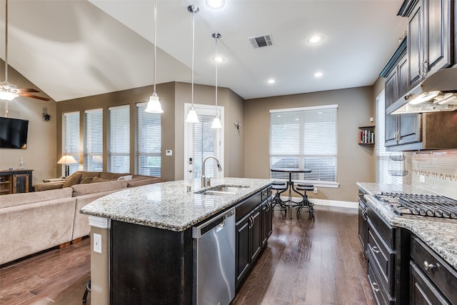 kitchen with a sink, visible vents, dark wood-style flooring, and stainless steel appliances