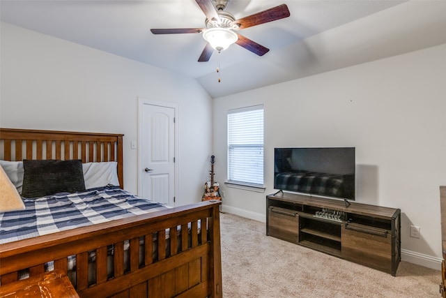 bedroom featuring baseboards, light colored carpet, ceiling fan, and vaulted ceiling