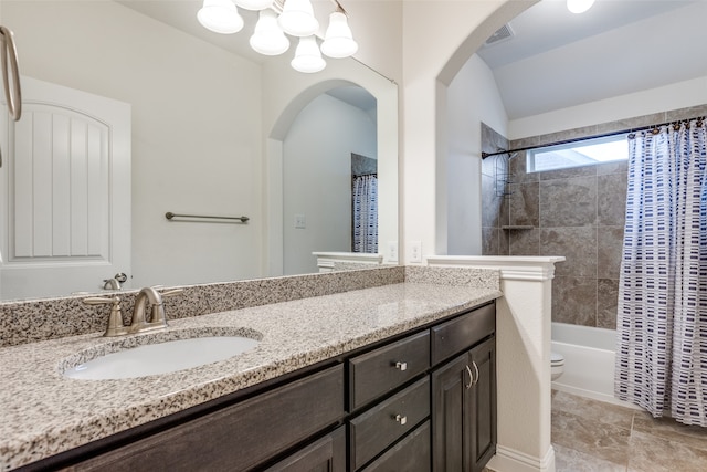 bathroom with vanity, visible vents, lofted ceiling, shower / tub combo, and toilet