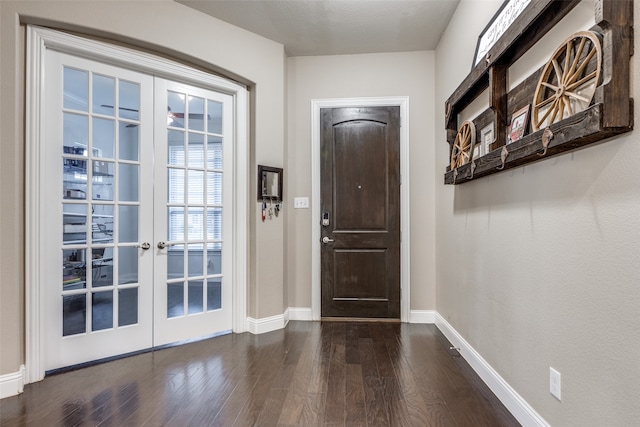 doorway featuring french doors, a textured ceiling, and dark hardwood / wood-style flooring