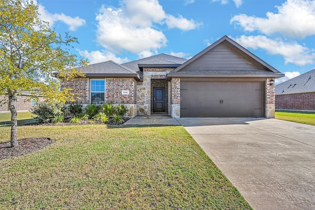 view of front facade featuring a front yard and a garage