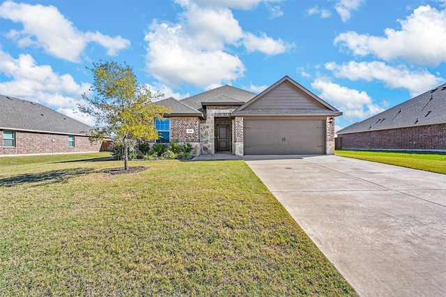 view of front of house featuring a front yard and a garage