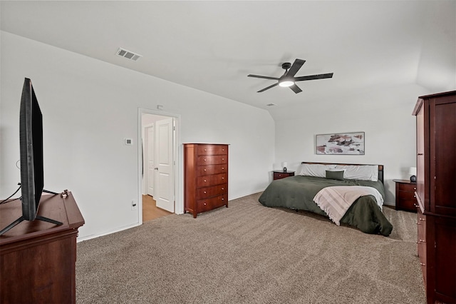 carpeted bedroom with ceiling fan and lofted ceiling