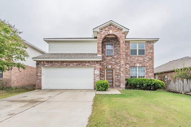 front of property featuring a front lawn and a garage