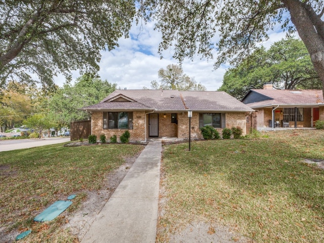 single story home with a front lawn