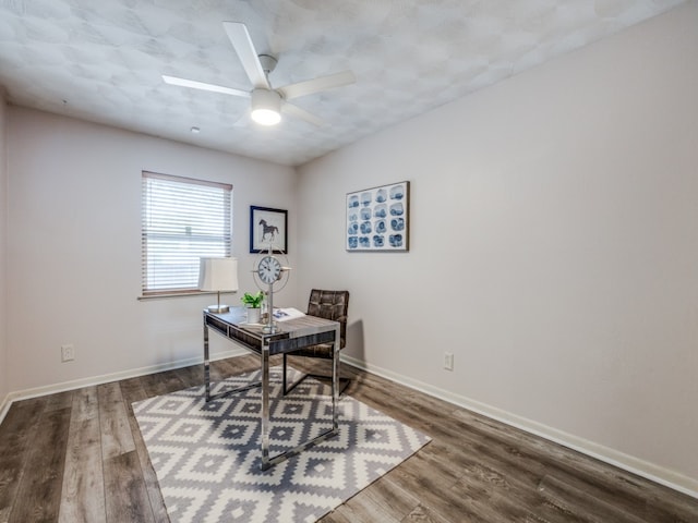 office space featuring dark wood-type flooring and ceiling fan