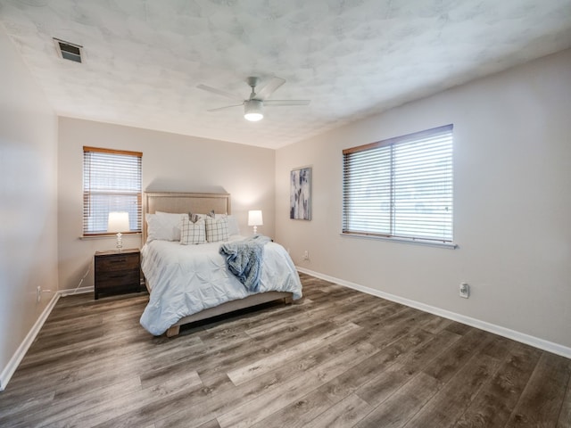 bedroom with ceiling fan and hardwood / wood-style floors