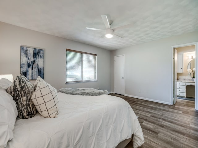 bedroom with ceiling fan, ensuite bathroom, and hardwood / wood-style floors