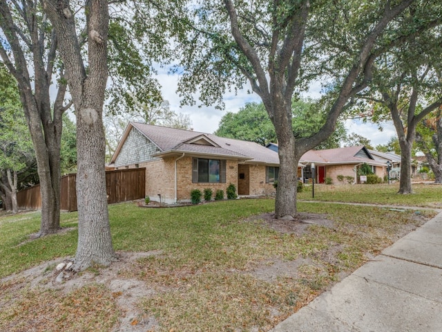 single story home featuring a front yard