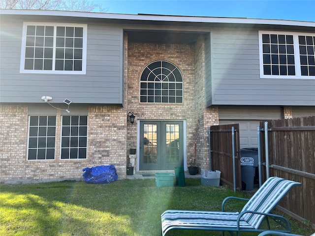 rear view of house with a yard