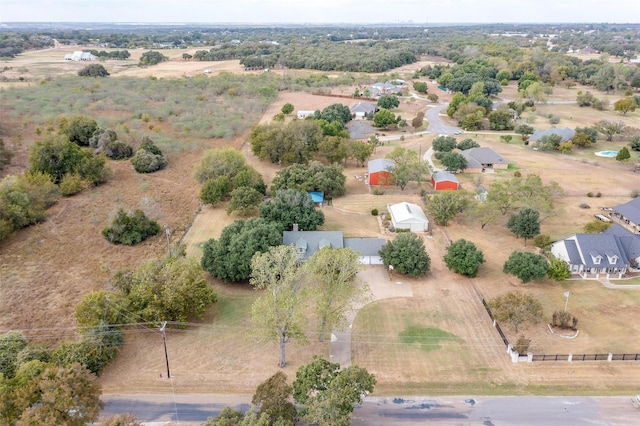 birds eye view of property with a rural view