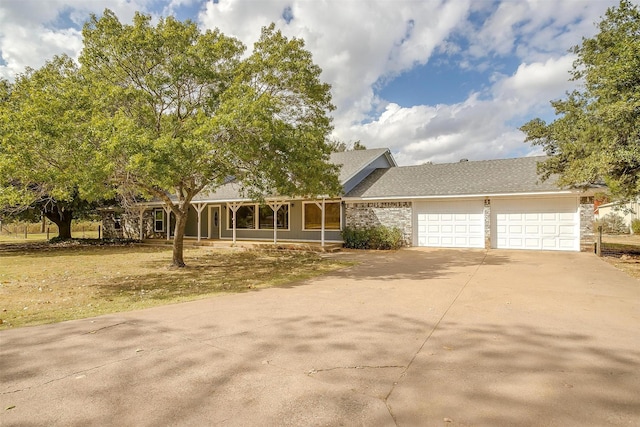 view of front of house with a garage and a front yard