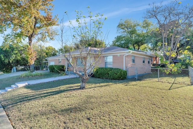 ranch-style home featuring a front yard