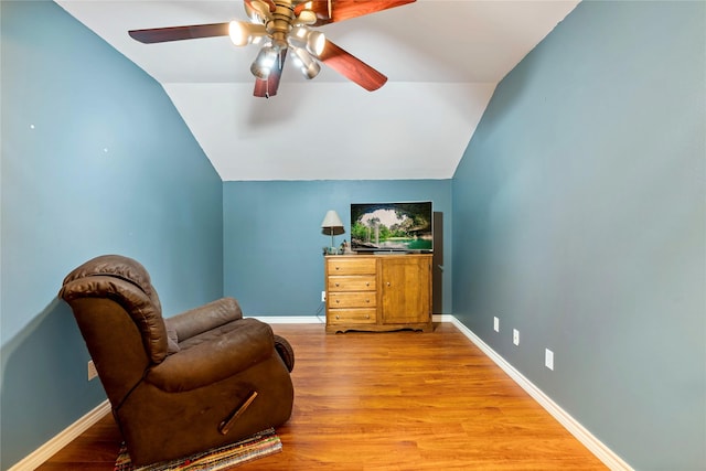 bedroom with hardwood / wood-style flooring, ceiling fan, and lofted ceiling