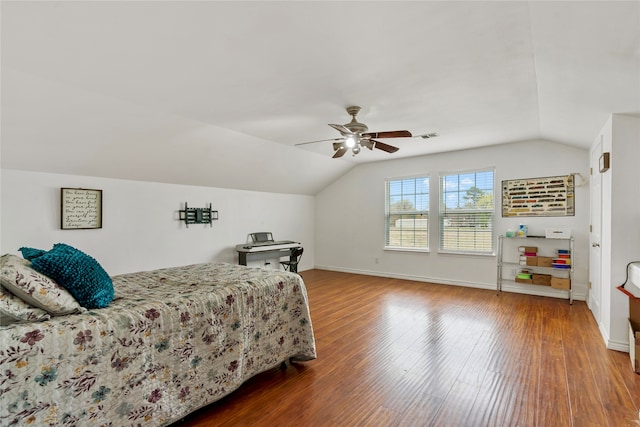 bedroom featuring hardwood / wood-style flooring, ceiling fan, and lofted ceiling