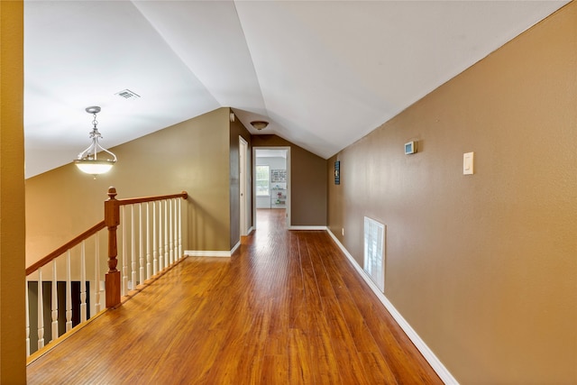 bathroom with hardwood / wood-style floors, vanity, toilet, a textured ceiling, and an enclosed shower