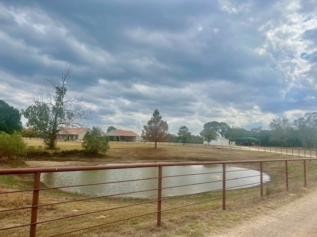 view of yard with a rural view