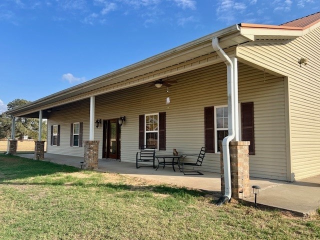 view of property exterior with covered porch and a garage