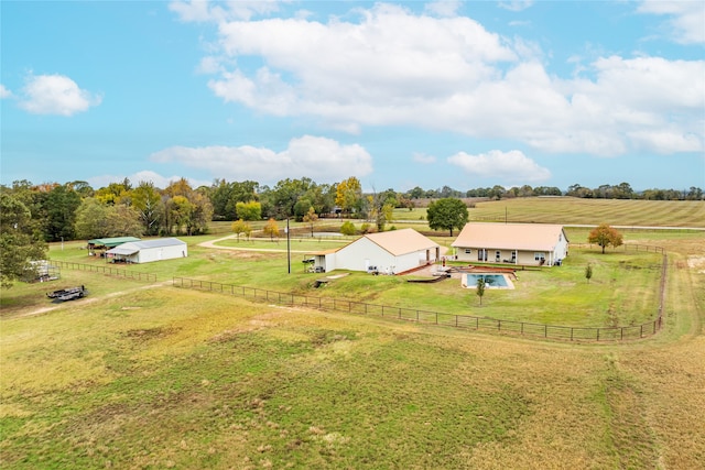 birds eye view of property with a rural view