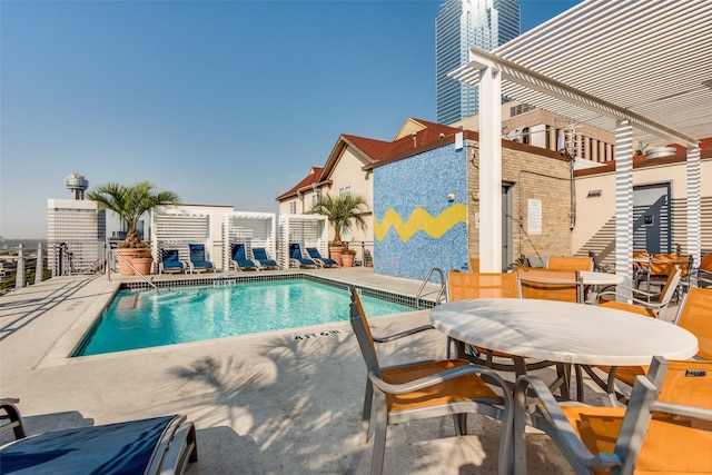 view of swimming pool featuring a patio