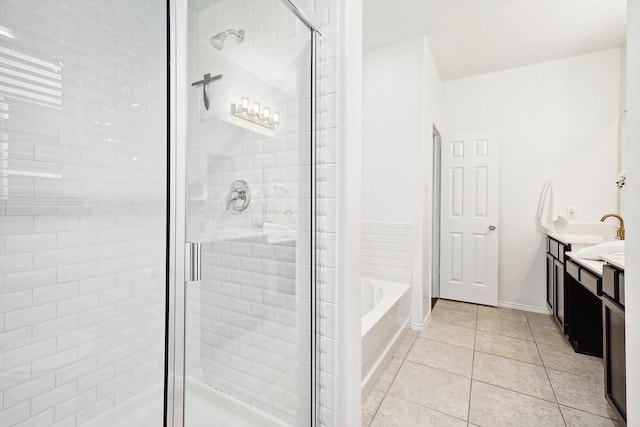 bathroom with vanity, shower with separate bathtub, and tile patterned flooring