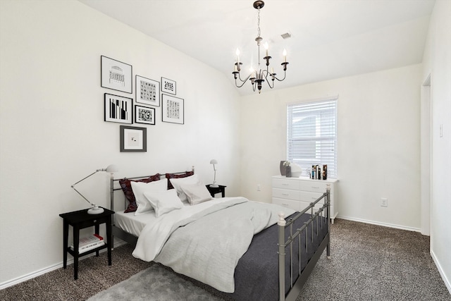 carpeted bedroom with an inviting chandelier