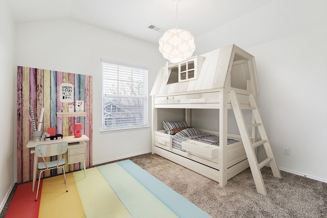 carpeted bedroom with lofted ceiling