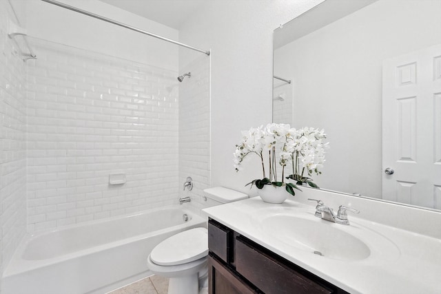 full bathroom featuring tiled shower / bath, vanity, toilet, and tile patterned floors