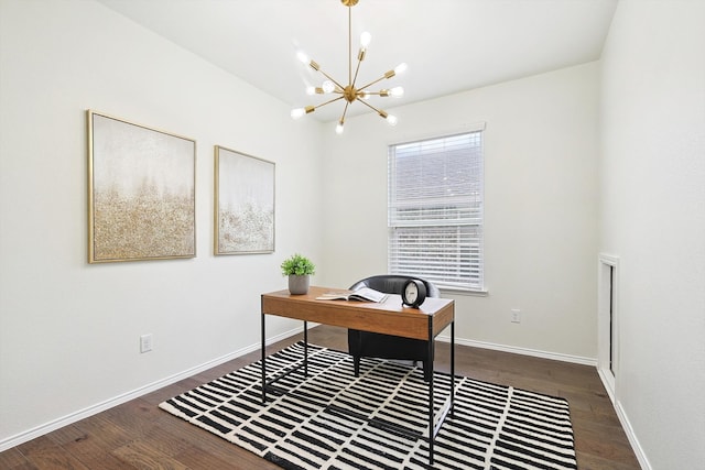 office area with dark hardwood / wood-style floors and an inviting chandelier