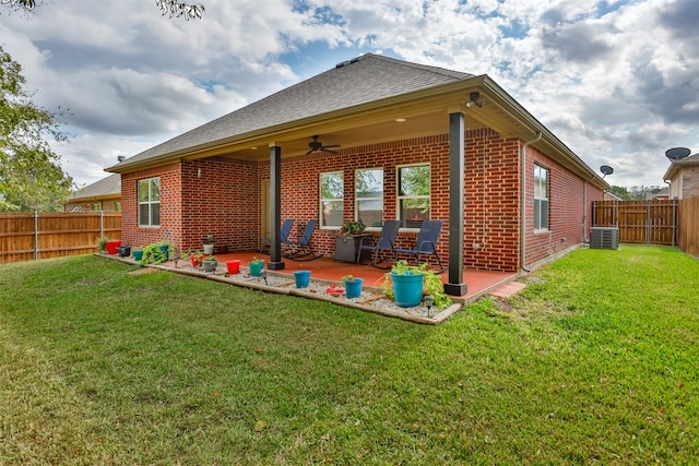 back of property with a yard, central air condition unit, a patio, and ceiling fan