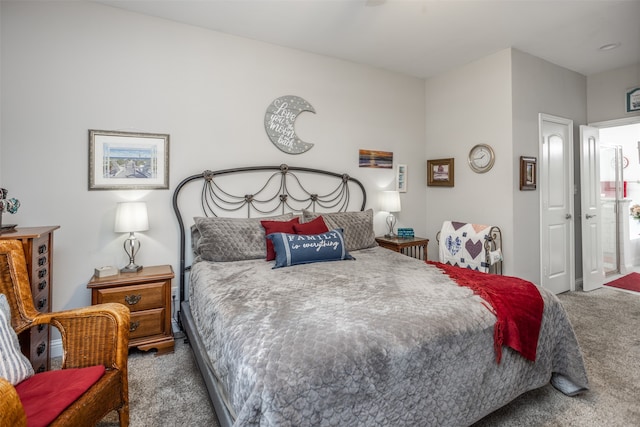 carpeted bedroom with ensuite bathroom