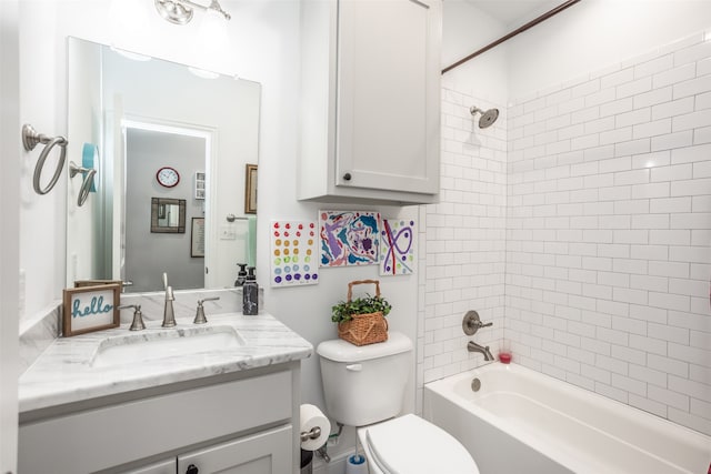 full bathroom featuring vanity, toilet, and tiled shower / bath