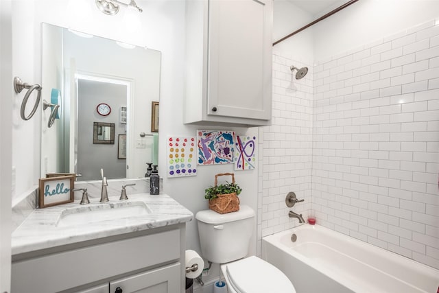 full bathroom with vanity, toilet, and tiled shower / bath