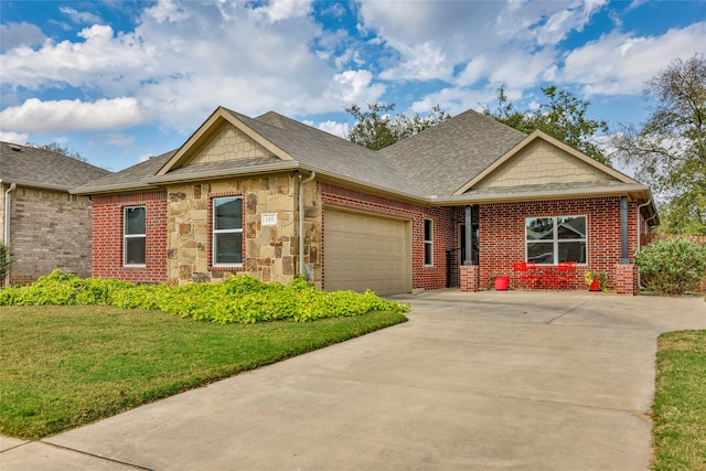 view of front of property featuring a front yard and a garage