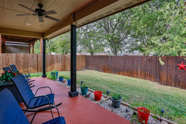 back house at dusk with a yard and a patio area