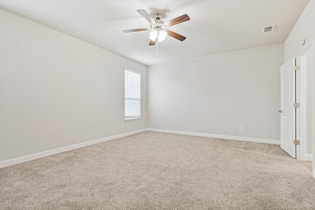 carpeted empty room with ceiling fan