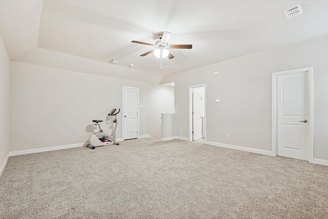 empty room with ceiling fan and carpet